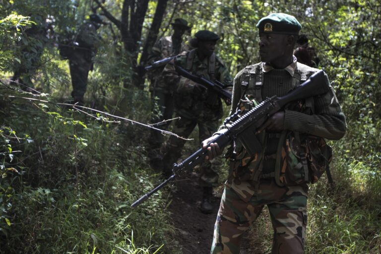 epa04119816 (17/22) Rangers of the Kenya Wildlife Service (KWS) and Kenya Forest Service (KFS) walk in forest during an anti-poaching training near Nanyuki, 200km north of Nairobi, Kenya, 05 December 2013. Kenyan rangers have been receiving patrol and field training from the British paratroopers to fight raising poaching in the country. EPA/DAI KUROKAWA PLEASE REFER TO ADVISORY NOTICE (epa04119799) FOR FULL FEATURE TEXT