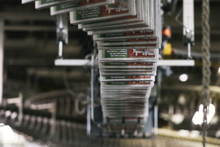 Newspapers in the production flow of the rotary printing machine, pictured at the printers Ringier Print Adligenswil in Adligenswil, Canton of Lucerne, Switzerland, on January 27, 2018. (KEYSTONE/Christian Beutler)