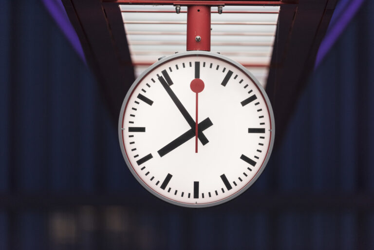 A Swiss railway station clock at Hardbruecke train station in Zurich, Switzerland, at dawn on January 17, 2019. (KEYSTONE/Christian Beutler)