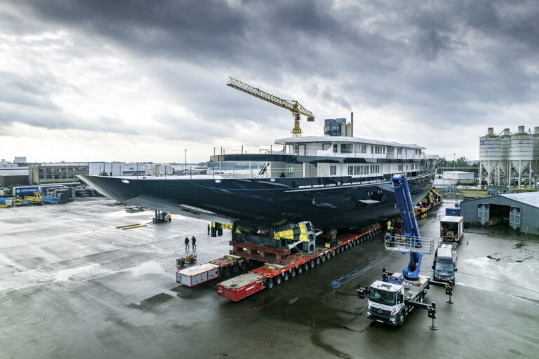 View of a yacht, reportedly being built for Amazon founder Jeff Bezos, on the wharf in Zwijndrecht, near Rotterdam, Netherlands, Wednesday, Oct. 21, 2021. A plan to dismantle a historic bridge in the heart of Dutch port city Rotterdam so that the huge yacht can get to the North Sea is unlikely to be plain sailing. Reports this week that the city had already agreed to take apart the recently restored Koningshaven Bridge, known locally as De Hef sparked anger in the city, with one Facebook group set up calling for people to pelt the multimillion dollar yacht with rotten eggs. (AP Photo/Guy Fleury)