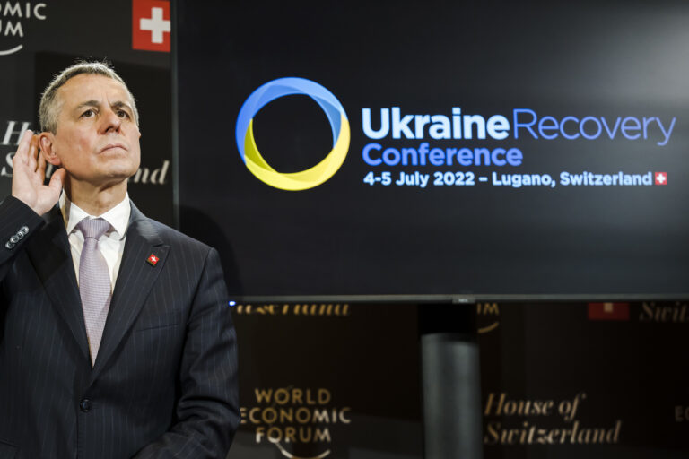 Ignazio Cassis, President of the Swiss Confederation, listen during a video meeting with Denys Shmygal, Prime Minister of Ukraine in the House of Switzerland during the 51st annual meeting of the World Economic Forum, WEF, in Davos, Switzerland, on Tuesday, May 24, 2022. The forum has been postponed due to the Covid-19 outbreak and was rescheduled to early summer. The meeting brings together entrepreneurs, scientists, corporate and political leaders in Davos under the topic 