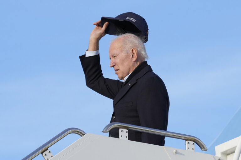 President Joe Biden waves as he boards Air Force One at Moffett Federal Airfield in Mountain View, Calif., after touring storm damage Thursday, Jan 19, 2023. (AP Photo/Susan Walsh)