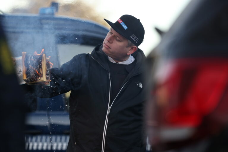 epa10433884 Rasmus Paludan, leader of Danish far-right anti-Islam party Stram Kurs (Hard Line), burns a copy of the Koran in front of the Turkish embassy in Copenhagen, Denmark, 27 January 2023. The action was met with outrage and protests around the world since Paludan burned a copy of the Muslim holy book in Stockholm a week earlier. EPA/Olafur Steinar Gestsson DENMARK OUT