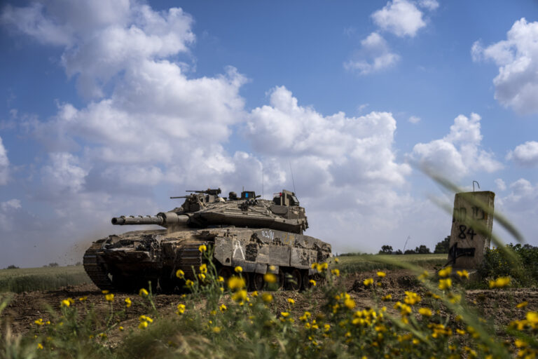 Israeli soldiers drive a tank on the border with Gaza Strip, in southern Israel, Tuesday, March 19, 2024. The army is battling Palestinian militants across Gaza in the war ignited by Hamas' Oct. 7 attack into Israel. (AP Photo/Ariel Schalit)