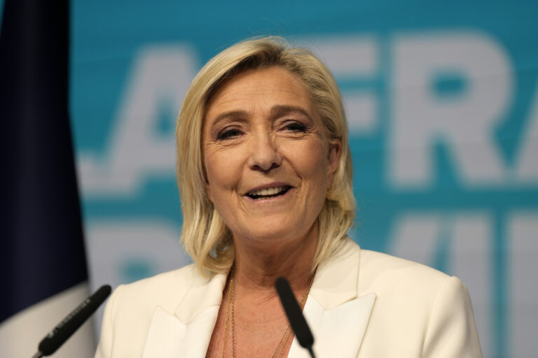 French far-right leader Marine Le Pen delivers her speech at the party election night headquarters after French President Emanuel Macron announced he dissolves National Assembly and calls new legislative election following the defeat in EU vote, Sunday, June 9, 2024 in Paris. First projected results from France put far-right National Rally party well ahead in EU elections, according to French opinion poll institutes. (AP Photo/Lewis Joly)