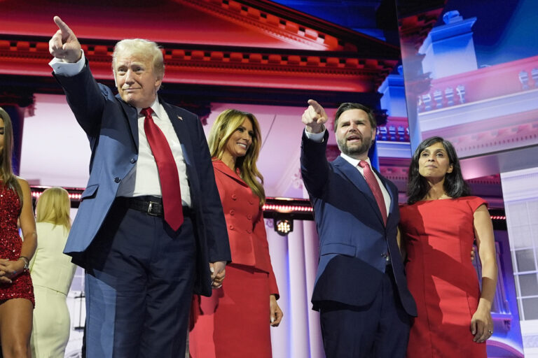 Republican presidential candidate former President Donald Trump stands on stage with former first lady Melania Trump, family members and Republican vice presidential candidate Sen. JD Vance, R-Ohio, and his wife Usha Chilukuri Vance, during the 2024 Republican National Convention at the Fiserv Forum, Thursday, July 18, 2024, in Milwaukee. (AP Photo/Carolyn Kaster)