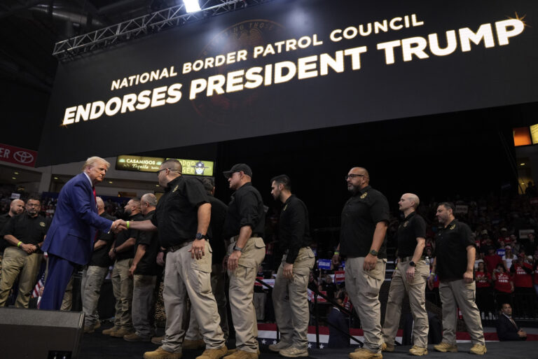 Republican presidential nominee former President Donald Trump greets members of the U.S. Border Patrol as he speaks at a campaign rally at the Findlay Toyota Arena Sunday, Oct. 13, 2024, in Prescott Valley, Ariz. (AP Photo/Evan Vucci).Donald Trump