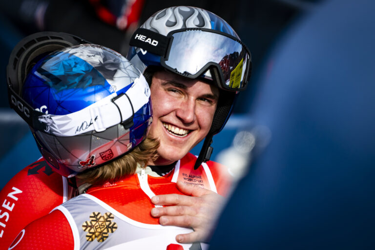 Marco Odermatt of Switzerland, left, reacts next to Franjo von Allmen of Switzerland, right, in the finish area during the men's Downhill race at the 2025 FIS Alpine World Ski Championships, in Saalbach-Hinterglemm, Austria, Sunday, February 9, 2025. (KEYSTONE/Jean-Christophe Bott)