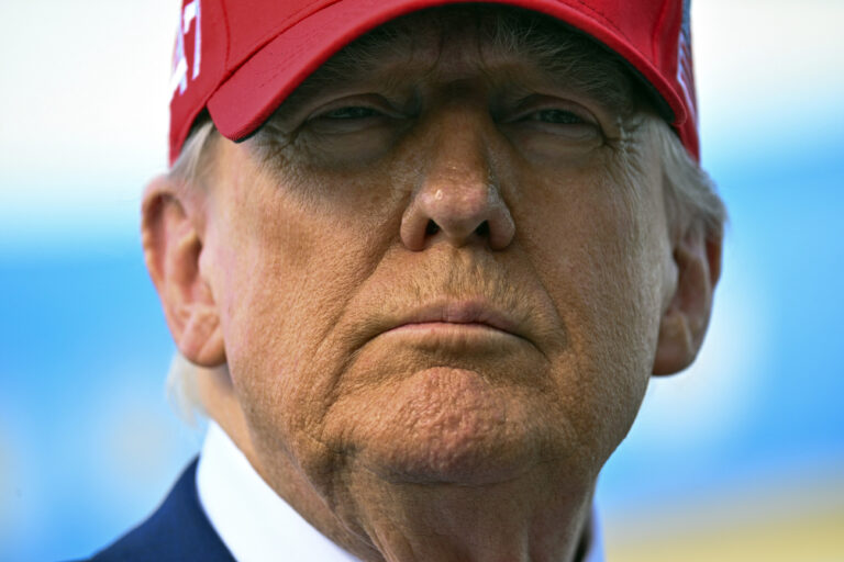 President Donald Trump speaks to reporters after landing at Palm Beach International Airport in West Palm Beach, Fla ., Sunday, Feb. 16, 2025, after attending the NASCAR Daytona 500 race (Pool via AP)