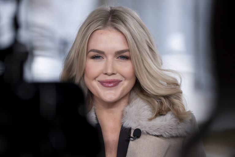 White House press secretary Karoline Leavitt prepares to do a television interview at the White House, Tuesday, Feb. 18, 2025, in Washington. (AP Photo/Alex Brandon)