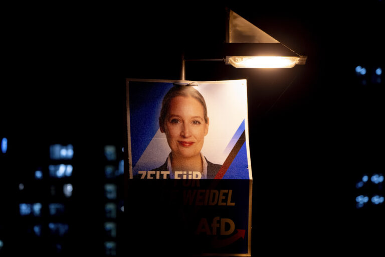 An election poster showing AfD top candidate for chancellor Alice Weidel is fixed on a lamp pole in Frankfurt, Germany, Thursday, Feb. 20, 2025. (AP Photo/Michael Probst)