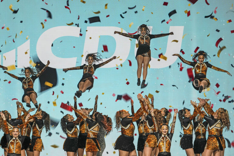 KEYPIX - Carnival dancers perform in front of the party logo at the main election campaign event of the Christian Democratic Union with CDU top candidate for chancellor Friedrich Merz ahead of the German federal Bundestag elections on Sunday, in Oberhausen, Germany, Friday, Feb. 21, 2025. (AP Photo/Martin Meissner)