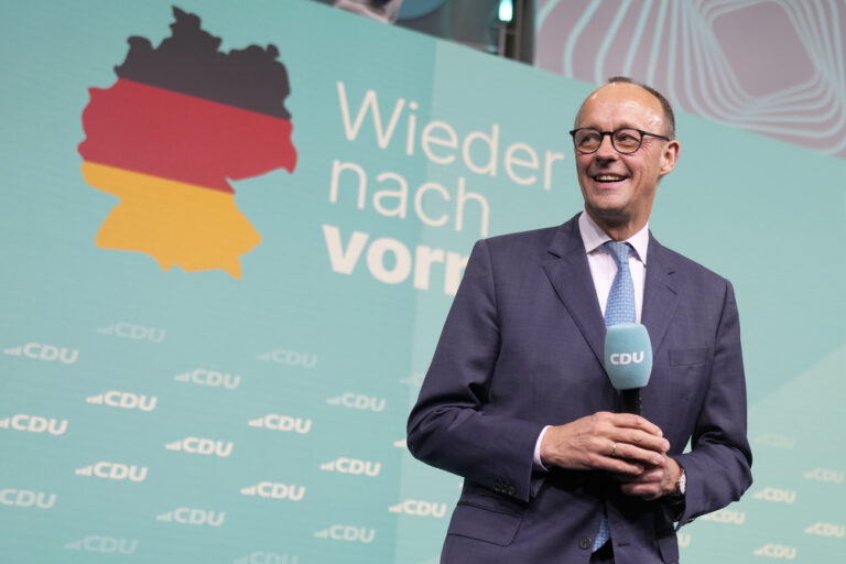 Friedrich Merz, the candidate of the mainstream conservative Christian Democratic Union party, smiles while addressing supporters at the party headquarters in Berlin, Germany, Sunday, Feb. 23, 2025, after the German national election. (AP Photo/Markus Schreiber)