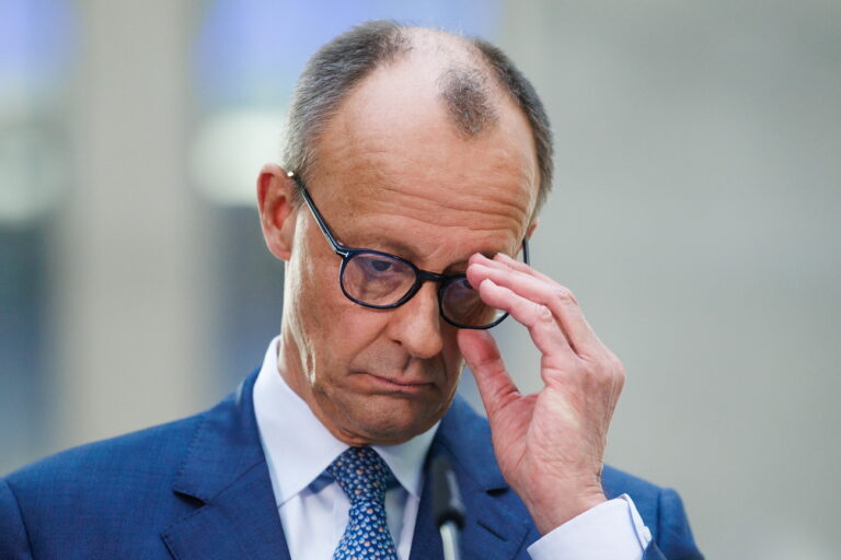 epa11949343 Chairman of the Christian Democratic Union (CDU) party and faction Friedrich Merz looks on at a press conference during ongoing exploratory talks on the premises of the German parliament, the Bundestag, in Berlin, Germany, 08 March 2025. Germany's Christian Democratic Union (CDU) and Social Democratic Party (SPD) continue exploratory talks on forming a potential governing coalition. EPA/CLEMENS BILAN