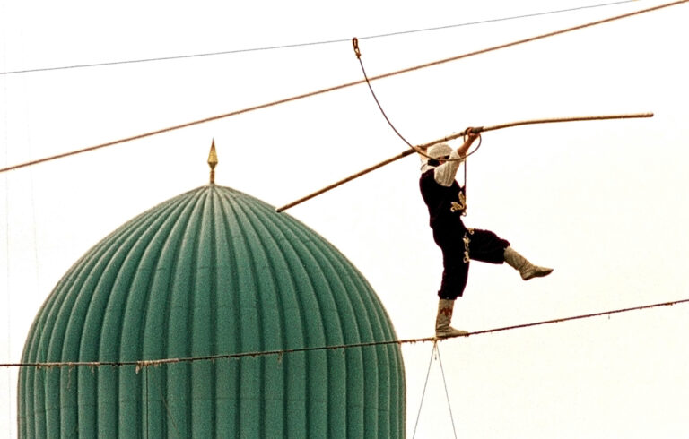 A rope walker performs during a celebration of the Persian New Year, known as Nowruz, in the Uzbek capital Tashkent, Thursday, March 21, 2002. Nowruz is observed across Central Asia and in Iran on the first day of spring as a celebration of harvest and rebirth. (AP Photo/ Anvar Ilyasov)