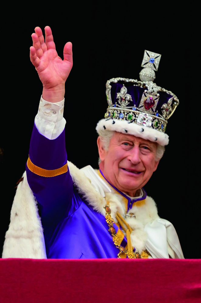 Britain's King Charles III waves from the Buckingham Palace balcony after his coronation, in London, Saturday, May 6, 2023. (Leon Neal/Pool Photo via AP)